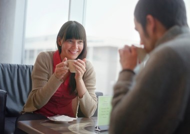 Young couple having coffee --- Image by © Mika/Corbis